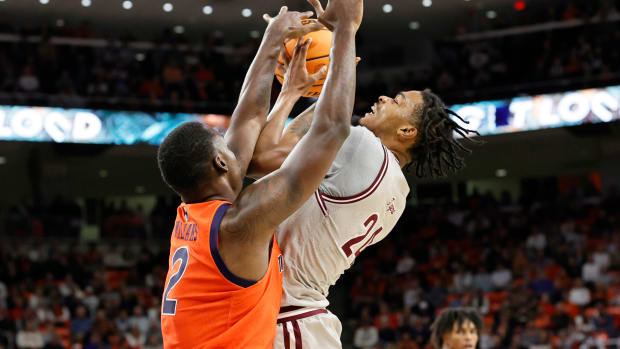 Nov 18, 2022; Auburn, Alabama, USA; Auburn Tigers forward Jaylin Williams (2) blocks the shot of Texas Southern Tigers forward John Walker III (24) during the first half at Neville Arena. Mandatory Credit: John Reed-USA TODAY Sports